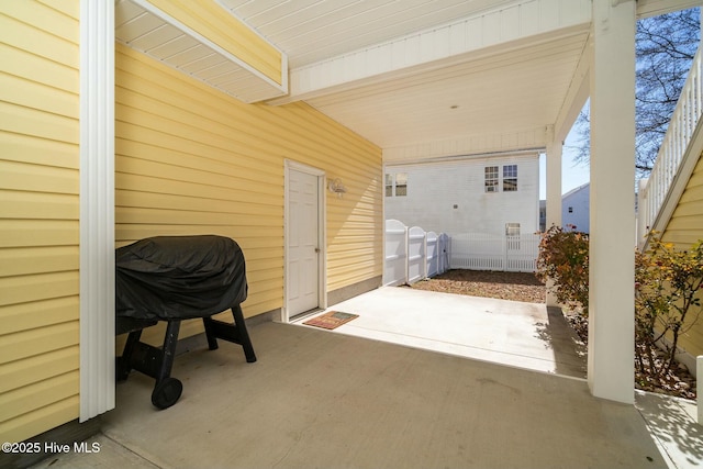 view of patio featuring fence