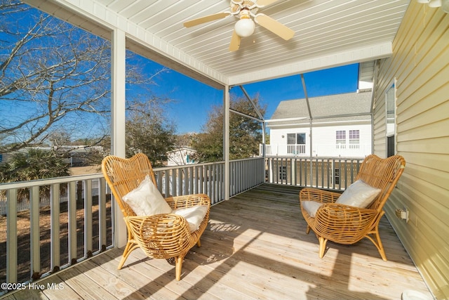 wooden deck featuring ceiling fan