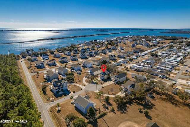 birds eye view of property with a residential view and a water view