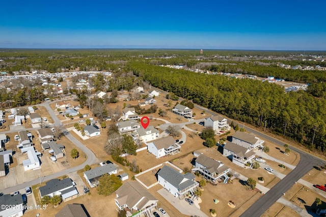 bird's eye view with a residential view and a wooded view