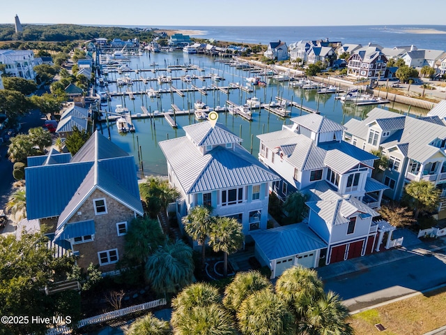 birds eye view of property featuring a water view