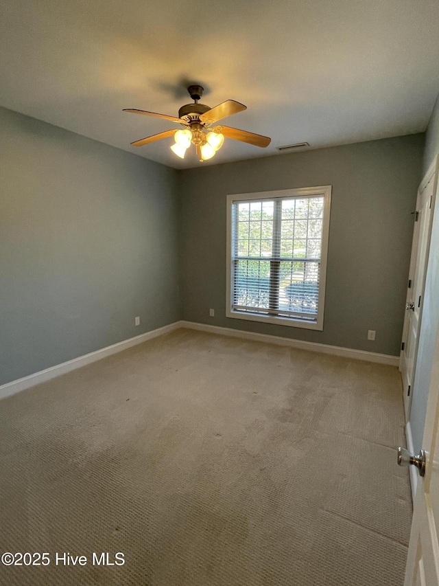 unfurnished bedroom featuring carpet, visible vents, and baseboards