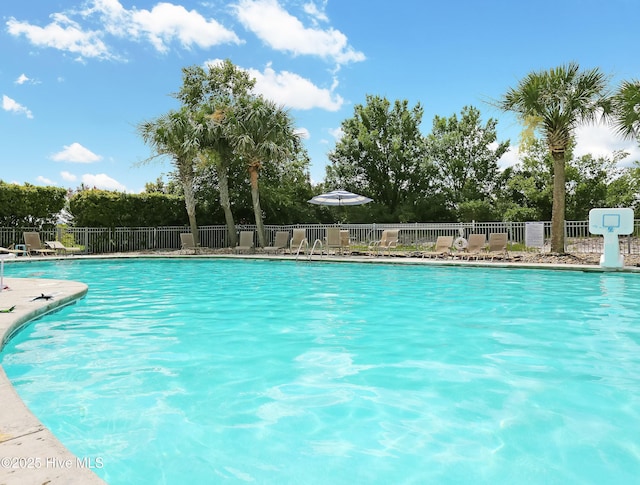 community pool featuring fence