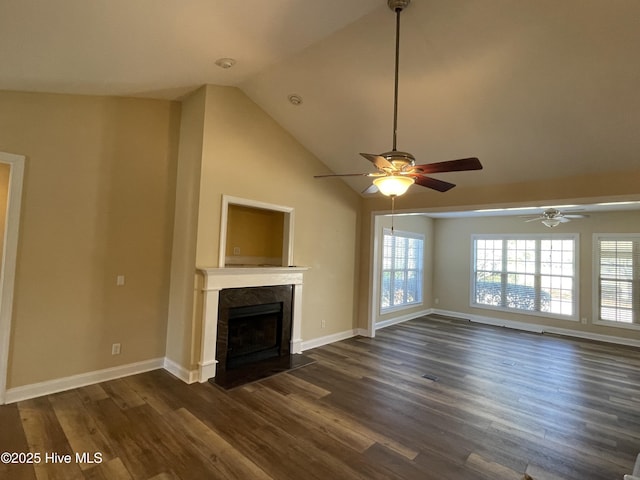 unfurnished living room featuring vaulted ceiling, dark wood-type flooring, a fireplace, and baseboards