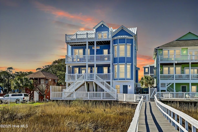 view of back of property at dusk