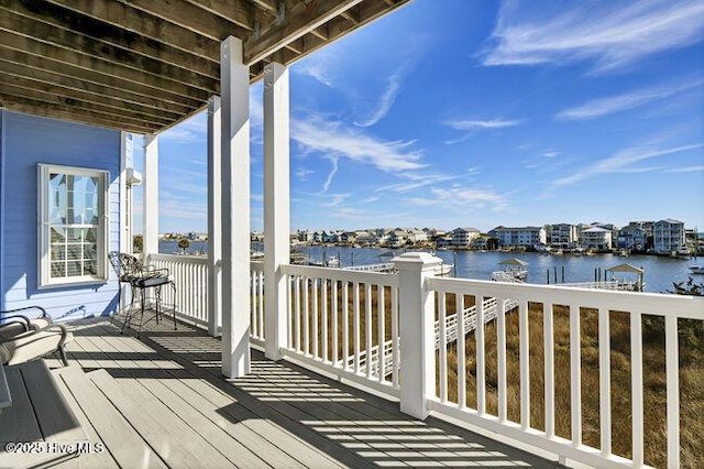 wooden deck with a water view