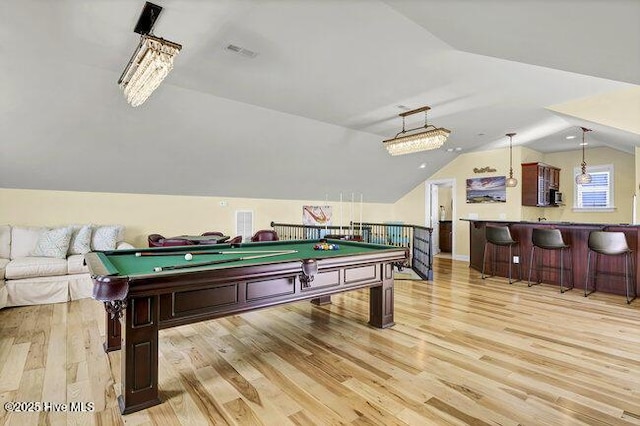 game room featuring lofted ceiling, light wood-type flooring, visible vents, and pool table