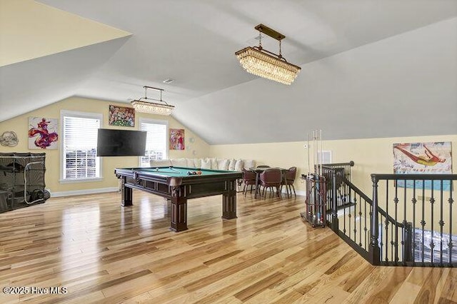 rec room featuring light wood-type flooring, pool table, lofted ceiling, and baseboards