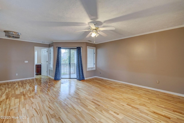 unfurnished room featuring baseboards, a textured ceiling, light wood-style flooring, and crown molding