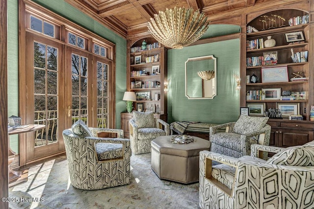 sitting room with coffered ceiling, wood ceiling, built in features, ornamental molding, and beamed ceiling