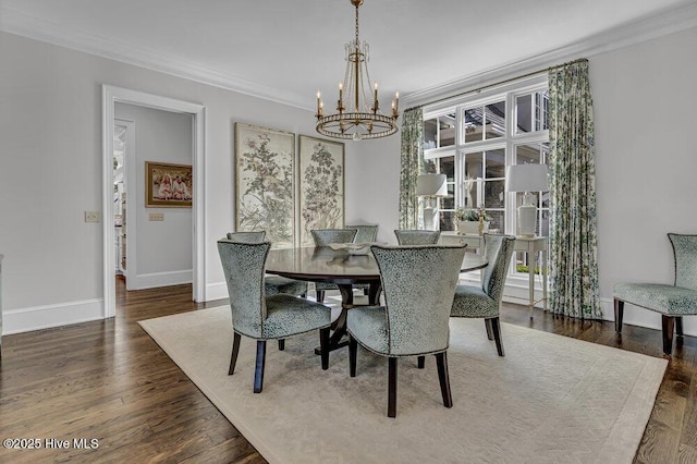 dining space featuring dark wood-style floors, a chandelier, a healthy amount of sunlight, and crown molding