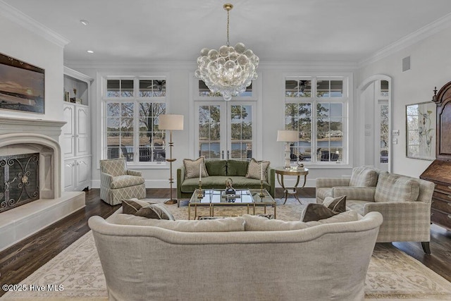 sunroom / solarium with a chandelier and a fireplace