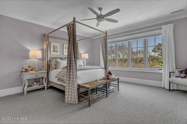 bedroom with carpet floors, visible vents, ornamental molding, and baseboards