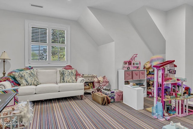 game room featuring lofted ceiling, carpet floors, and visible vents