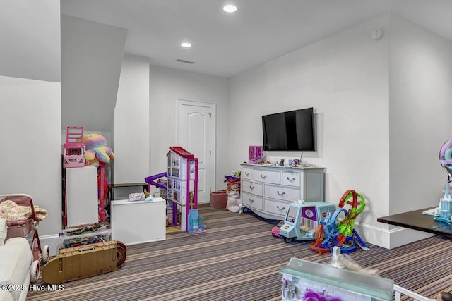 rec room with visible vents, dark colored carpet, and recessed lighting