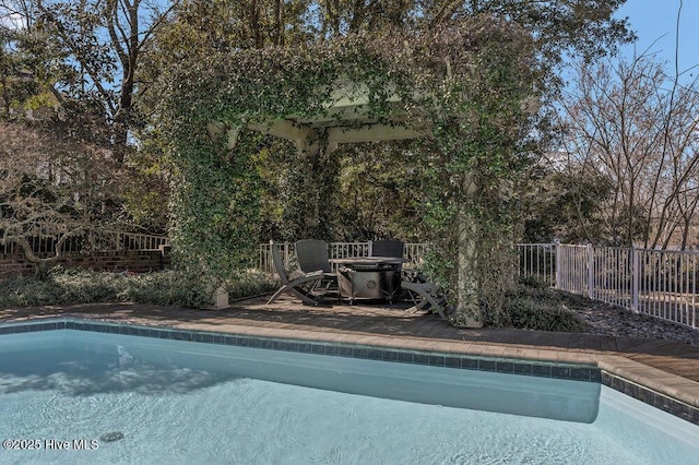 view of pool with fence and a fenced in pool