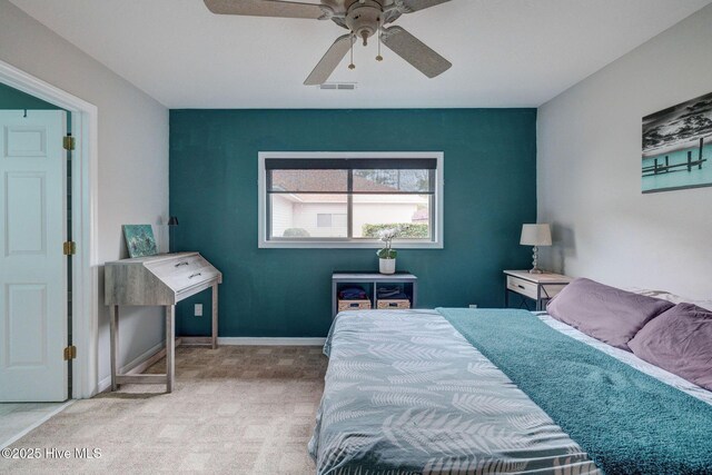 carpeted bedroom featuring a ceiling fan and a closet