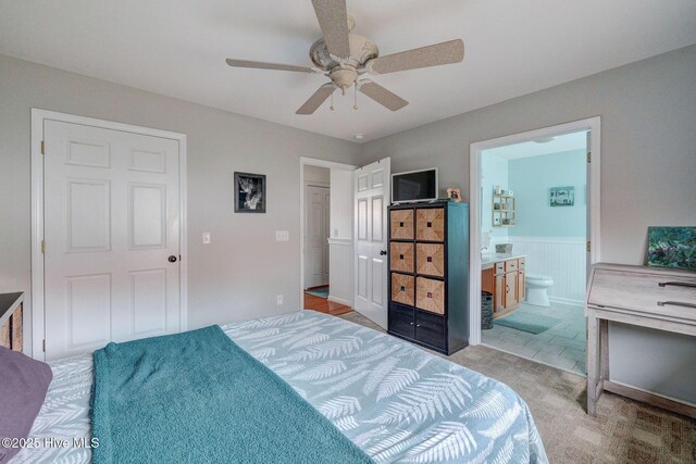 bedroom featuring light carpet, ceiling fan, visible vents, and baseboards