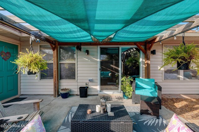 view of patio featuring outdoor lounge area and a fenced backyard