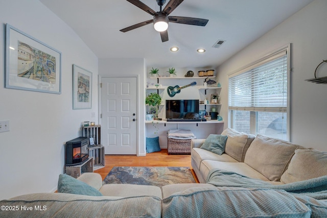 living area with ceiling fan, light wood finished floors, visible vents, and recessed lighting