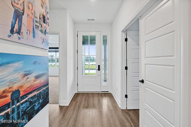 sitting room featuring light wood-type flooring, recessed lighting, a fireplace, and baseboards