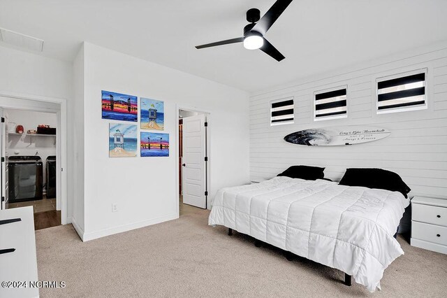 spacious closet with light carpet