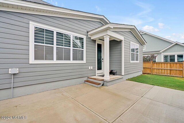 view of yard featuring a fenced backyard, a trampoline, and a patio