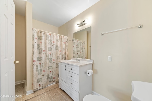 full bathroom featuring tile patterned flooring, curtained shower, toilet, and vanity