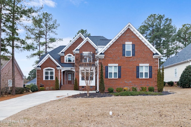 traditional home featuring brick siding and crawl space