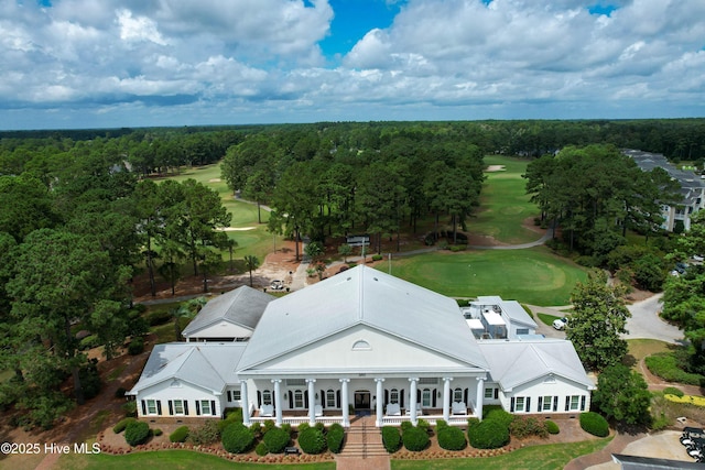 bird's eye view featuring a wooded view