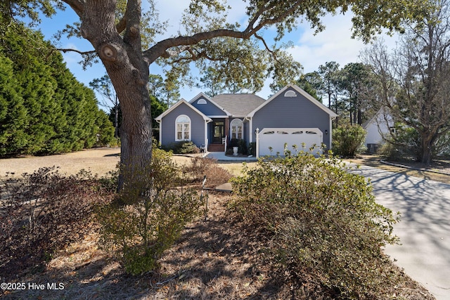 ranch-style house featuring a garage and concrete driveway