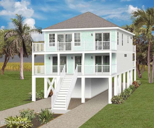 rear view of property with stairway, a balcony, roof with shingles, a porch, and a yard