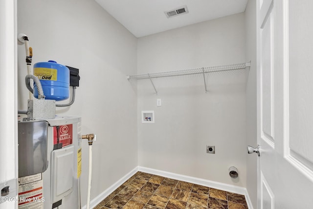 laundry area featuring laundry area, visible vents, baseboards, washer hookup, and electric dryer hookup