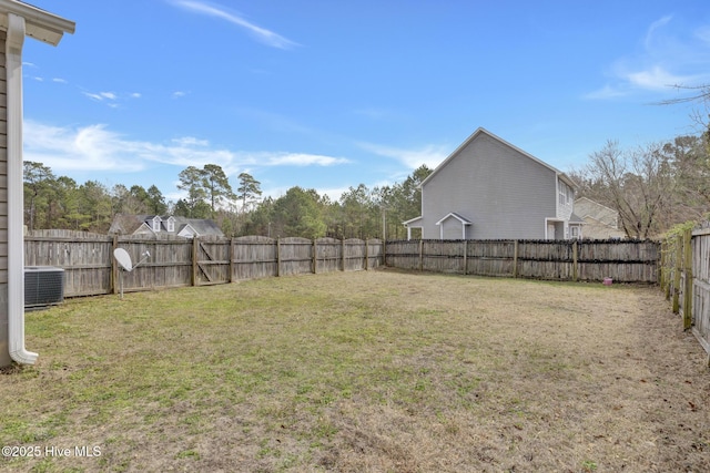 view of yard featuring cooling unit and a fenced backyard