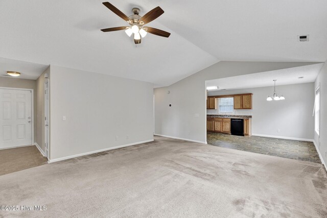 unfurnished living room with carpet, baseboards, vaulted ceiling, and ceiling fan with notable chandelier