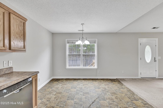 interior space featuring a chandelier, carpet flooring, visible vents, and baseboards