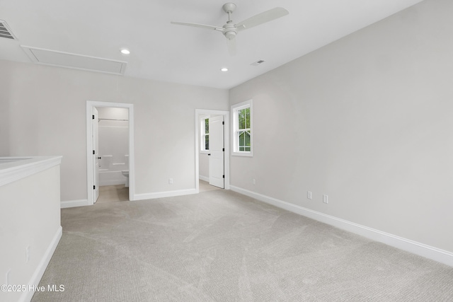 unfurnished bedroom featuring recessed lighting, light colored carpet, visible vents, baseboards, and attic access