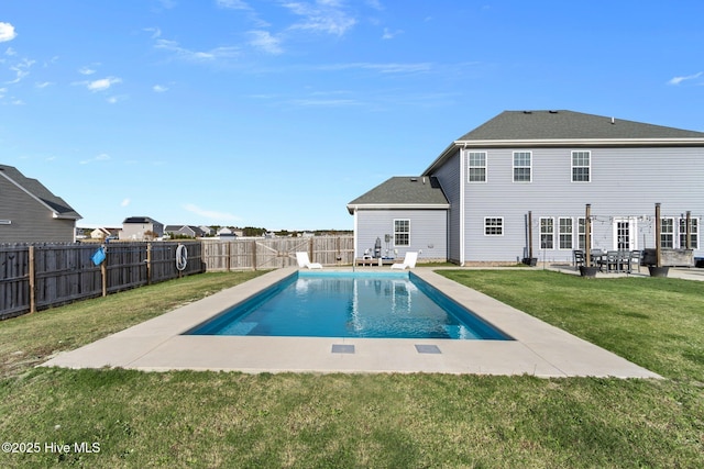 view of pool with a patio area, a fenced backyard, a fenced in pool, and a lawn