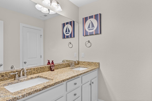 bathroom featuring double vanity and a sink