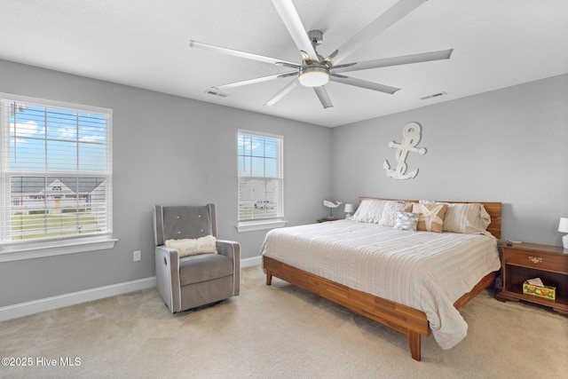 bedroom with visible vents, ceiling fan, light carpet, and baseboards