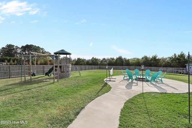 exterior space featuring playground community, a patio area, and a fenced backyard