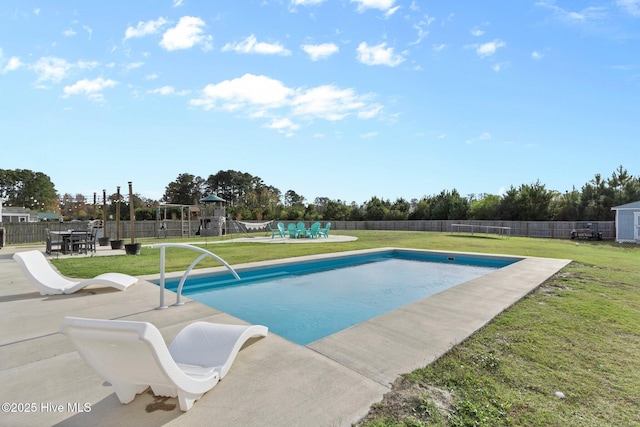 view of swimming pool with a fenced in pool, a playground, a patio, a lawn, and a fenced backyard