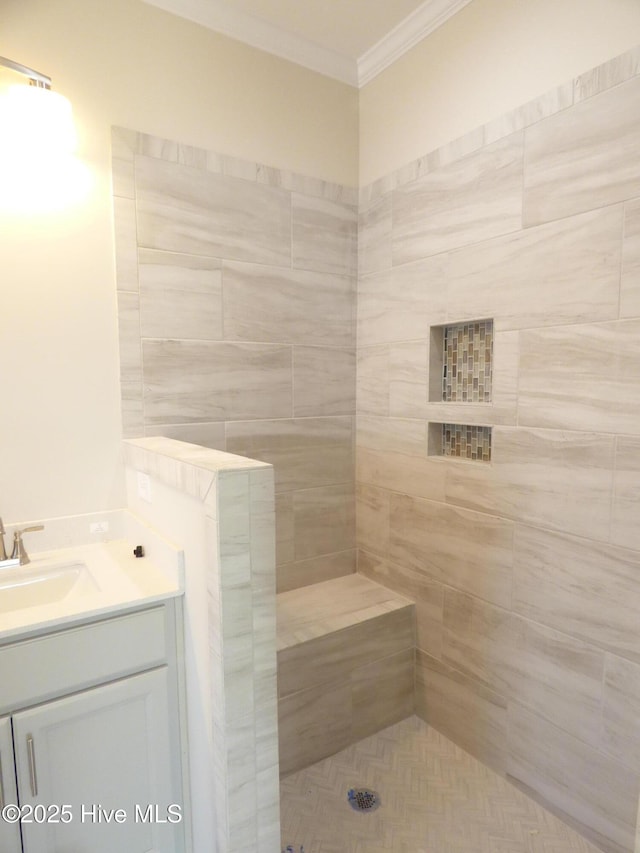 bathroom featuring ornamental molding, tiled shower, a sauna, and vanity