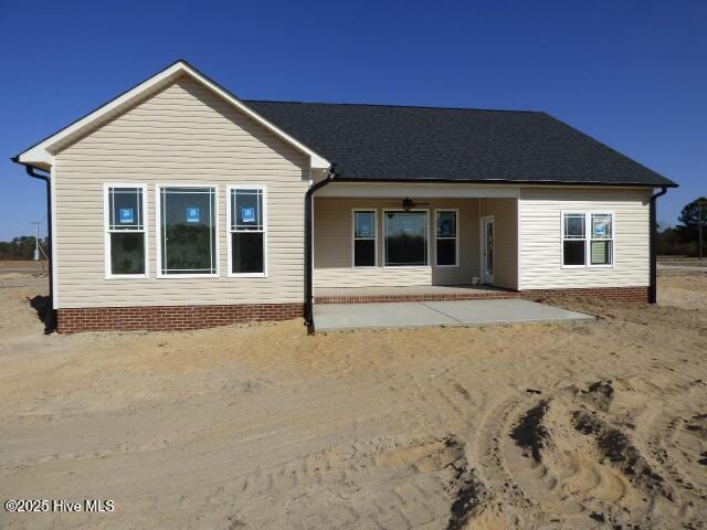 rear view of property featuring a patio area