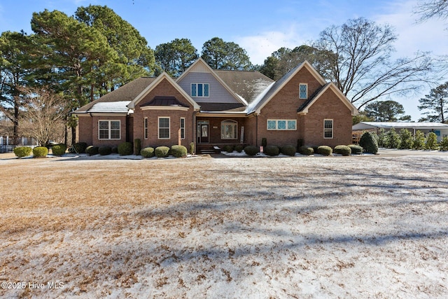 view of front of house featuring brick siding