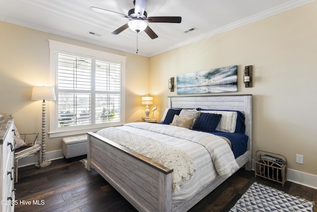 bedroom featuring dark wood-style flooring, visible vents, and crown molding