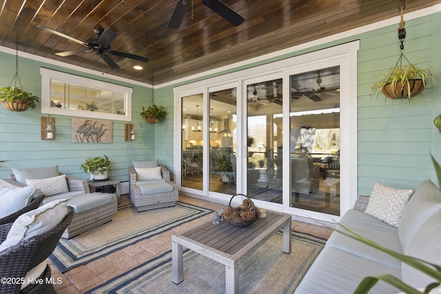 wooden deck featuring an outdoor hangout area and a ceiling fan