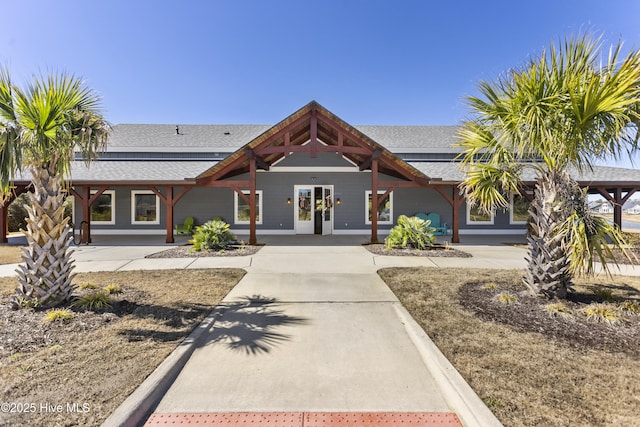 view of front of home with a shingled roof