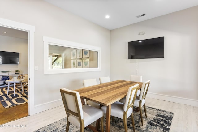 dining room featuring recessed lighting, visible vents, baseboards, and wood finished floors