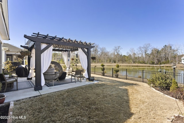 view of yard with a patio, a water view, a fenced backyard, and a pergola